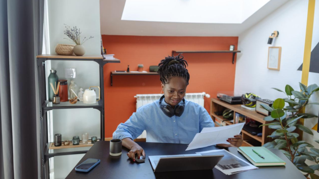Remote worker using AI tools and productivity software in a modern home office