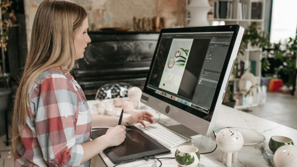 Content creator using AI image generation tools to create digital artwork on a desktop computer